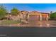 Charming home featuring a terracotta roof, arched entryway, and a three-car garage at 12809 W Oyer Ln, Peoria, AZ 85383