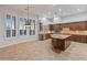Large gourmet kitchen with wooden cabinets, granite countertops, stainless steel appliances, and large windows at 12809 W Oyer Ln, Peoria, AZ 85383