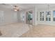 Spacious living room with a ceiling fan and sliding glass doors to the backyard and pool at 12809 W Oyer Ln, Peoria, AZ 85383