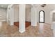 Open-concept space with archways leading to a living room and tiled floor at 12809 W Oyer Ln, Peoria, AZ 85383