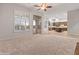 Open living room with backyard and kitchen views at 12809 W Oyer Ln, Peoria, AZ 85383