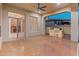 Entertainer's patio with a built-in outdoor kitchen, ample seating and backyard views at 12809 W Oyer Ln, Peoria, AZ 85383
