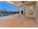 Covered patio with flagstone flooring offering seamless indoor-outdoor living and views of the pool and backyard at 12809 W Oyer Ln, Peoria, AZ 85383