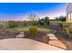 Backyard putting green complemented by desert landscaping and stepping stones at 12809 W Oyer Ln, Peoria, AZ 85383