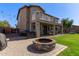 Fire pit and backyard featuring a covered patio and a lush lawn at 1342 E Jade Dr, Chandler, AZ 85286