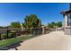 View of the concrete patio with a backyard featuring a playground, perfect for outdoor enjoyment at 1342 E Jade Dr, Chandler, AZ 85286