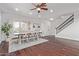 Bright dining room featuring a wood table, seating for eight, and a view of the entry and staircase at 1342 E Jade Dr, Chandler, AZ 85286