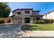 Inviting two-story home with manicured landscaping and a spacious three car garage at 1342 E Jade Dr, Chandler, AZ 85286