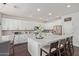 Bright kitchen featuring a spacious island, white cabinets, and stainless steel appliances at 1342 E Jade Dr, Chandler, AZ 85286