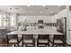 Bright kitchen featuring a spacious island, white cabinets, and stainless steel appliances at 1342 E Jade Dr, Chandler, AZ 85286