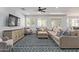 Cozy living room with comfortable sectional sofa, plush seating, and bright windows at 1342 E Jade Dr, Chandler, AZ 85286