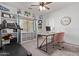 Stylish home office featuring custom built-ins, a treadmill, and a cozy desk area at 1342 E Jade Dr, Chandler, AZ 85286