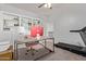 Bright home office with custom shelves, modern desk, and a convenient treadmill at 1342 E Jade Dr, Chandler, AZ 85286