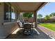 Covered patio with outdoor dining set, perfect for entertaining in this backyard at 1342 E Jade Dr, Chandler, AZ 85286