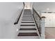 Elegant staircase with dark wood steps and decorative iron railings at 1342 E Jade Dr, Chandler, AZ 85286