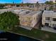 Birds eye view of home on a river featuring well manicured lawn and patio at 1414 W Coral Reef Dr, Gilbert, AZ 85233