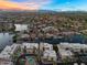 Expansive aerial view of a residential area with waterfront properties, pools, and manicured landscaping at 1414 W Coral Reef Dr, Gilbert, AZ 85233
