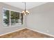 A dining room has beautiful window with chandelier lighting at 1414 W Coral Reef Dr, Gilbert, AZ 85233