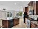 Modern kitchen featuring granite countertops, stainless steel appliances, and a large island at 1414 W Coral Reef Dr, Gilbert, AZ 85233