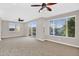 A bright living room includes two ceiling fans and natural light at 1414 W Coral Reef Dr, Gilbert, AZ 85233