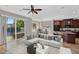 Stylish living room showcasing an open floor plan with a lake view, modern furnishings, and ample natural light at 1414 W Coral Reef Dr, Gilbert, AZ 85233