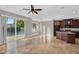 Bright, open living area with tile flooring, a ceiling fan, and sliding glass doors to the backyard at 1414 W Coral Reef Dr, Gilbert, AZ 85233