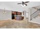 A spacious living room features a kitchen with a central island and staircase at 1414 W Coral Reef Dr, Gilbert, AZ 85233