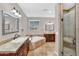 A main bathroom features a walk-in shower and soaking tub at 1414 W Coral Reef Dr, Gilbert, AZ 85233