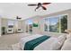 Spacious main bedroom with abundant natural light, comfortable seating, and a private balcony at 1414 W Coral Reef Dr, Gilbert, AZ 85233