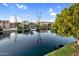 Beautiful waterfront view of luxury homes and boat on the canal at 1414 W Coral Reef Dr, Gilbert, AZ 85233
