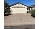 Charming single-story home featuring a two-car garage and well-maintained front yard at 15088 N 85Th Dr, Peoria, AZ 85381