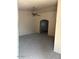 Cozy living room showcasing gray carpet, neutral walls, and an elegant ceiling fan at 15088 N 85Th Dr, Peoria, AZ 85381
