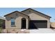 Inviting single-story home featuring a two-car garage, neutral stucco, and a low-maintenance desert landscape at 15517 W Corte Del Sol Este --, Waddell, AZ 85355