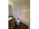 Bathroom with a tub and shower combo, single sink vanity, and neutral finishes at 15731 W Evans Dr, Surprise, AZ 85379