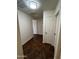 Hallway featuring tile flooring and access to multiple rooms at 15731 W Evans Dr, Surprise, AZ 85379