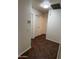 Hallway features tiled floors and neutral paint for a clean, modern look at 15731 W Evans Dr, Surprise, AZ 85379