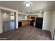 Well-equipped kitchen with essential appliances and a view to the living room, perfect for meal prep at 15731 W Evans Dr, Surprise, AZ 85379