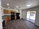 Bright kitchen featuring modern appliances and sliding glass doors, offering easy access to the outdoors at 15731 W Evans Dr, Surprise, AZ 85379