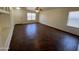 Well lit open concept living room, featuring tile floors and a ceiling fan for added comfort at 15731 W Evans Dr, Surprise, AZ 85379