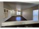 Inviting living room with ample natural light, tiled flooring, and a ceiling fan for added comfort at 15731 W Evans Dr, Surprise, AZ 85379