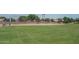 A baseball field with a grassy outfield and chain-link fence at 15737 W Lundberg St, Surprise, AZ 85374