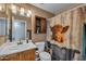 Standard bathroom with a shower curtain and a traditional vanity at 15737 W Lundberg St, Surprise, AZ 85374