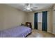 Bedroom with a ceiling fan, tile floors, and a traditional-style bed frame at 15737 W Lundberg St, Surprise, AZ 85374