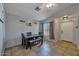 Dining room with a wooden table, tile floors, and a view of the front entrance, creating a welcoming space at 15737 W Lundberg St, Surprise, AZ 85374