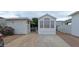Charming manufactured home features a well-maintained front yard, covered parking, and beautiful landscaping at 17200 W Bell Rd # 1501, Surprise, AZ 85374