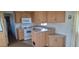 Spacious kitchen features wooden cabinetry, white appliances, and functional design at 17200 W Bell Rd # 1501, Surprise, AZ 85374