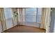 Sunroom features large windows with blinds and curtains, with neutral carpeting, and natural light at 17200 W Bell Rd # 1501, Surprise, AZ 85374
