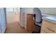 A functional office space with built-in desk, wood cabinets, and neutral carpeting at 17200 W Bell Rd # 1501, Surprise, AZ 85374