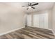This cozy bedroom features a ceiling fan and closet with laminate flooring at 17228 N 16Th Dr # 3, Phoenix, AZ 85023