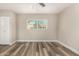 Bedroom with wood-style floors, natural light, and a closet at 17228 N 16Th Dr # 3, Phoenix, AZ 85023